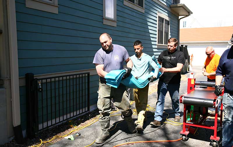 carrying epoxy filled sewer liner to distributor